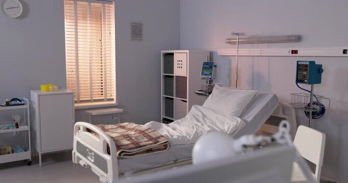 A modern hospital room with advanced medical equipment and a comfortable patient bed