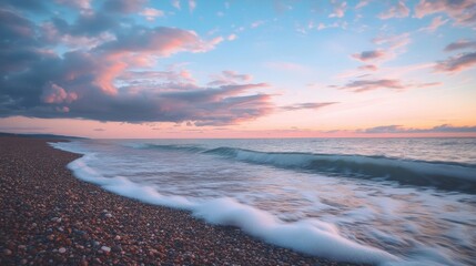 Fototapeta premium Calm Beach Sunset with Gentle Waves and Colorful Sky