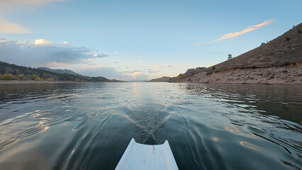 dusk rowing on calm water of Horsetooth reservoir in Colorado - POV rower perspective © MarekPhotoDesign.com