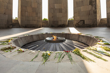 Yerevan, Yerevan Province, Armenia. The eternal flame with flowers, in the Memorial Hall at the...