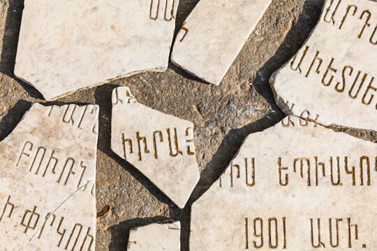 Western Asia, Eurasia, South Caucasus, Republic of Armenia. Sevan. Broken stone tablets outside of the church of Surp Arakelots at the Sevanavank Monastery complex on Lake Sevan.