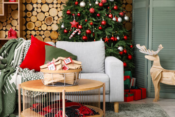 Interior of living room with sofa, Christmas tree and Advent calendar on table