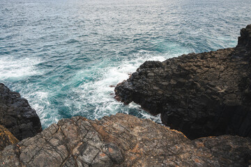 waves crashing on rocks