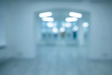 Blurred view of new empty room with windows