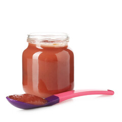 Baby food. Tasty puree in glass jar and spoon isolated on white