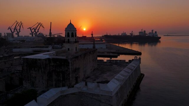 Veracruz Sunrise: San Juan de Ulua and the Port&rsquo;s Cargo Ships Illuminated by the First Light of Day.