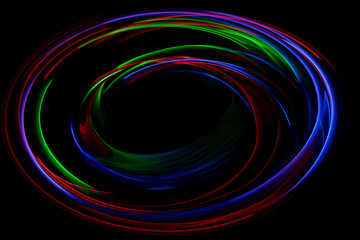 黒バックの中にある様々な色の光の渦