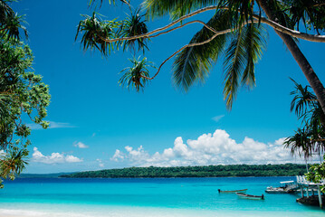 Experience the untamed beauty of Bokissa Island in Vanuatu with clear skies and turquoise waters