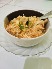 Creamy noodle soup with spices and vegetables.