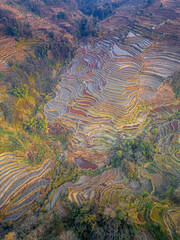 Sunset over Bada rice terraces in Yuanyang rice terraces, Yunnan, China, aerial, close up, copy space for text