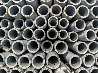 Construction Pipes: A close-up perspective showcases rows of cylindrical pipes, their circular openings creating a repetitive pattern.
