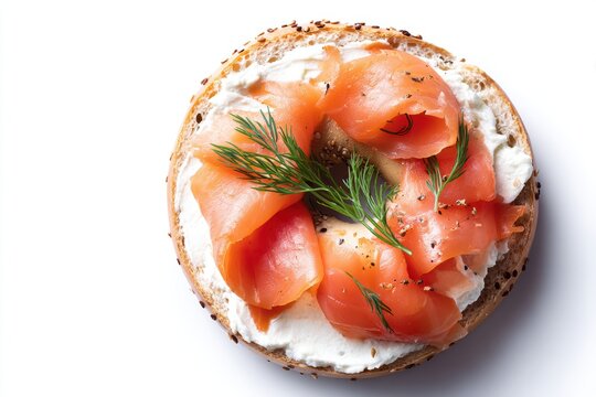 Delicious bagel with fresh cream cheese lox and dill herb served on a white isolated background for healthy breakfast