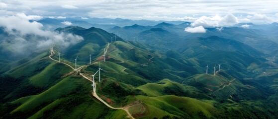 Dramatic aerial vista of lush green mountain range with towering wind turbines for sustainable energy production