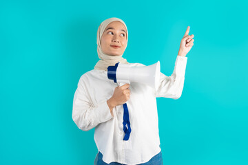 portrait of female holding megaphone smiling and pointing up