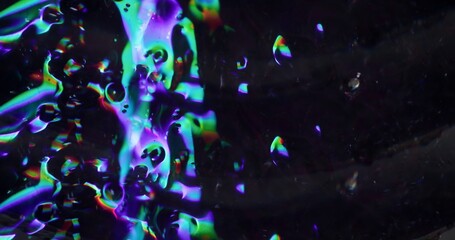 Moving particles. Defocused colorful transparent. Bubbles texture sparkling gleaming liquid motion...