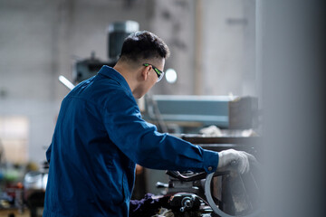 asian male engineer working in factroy