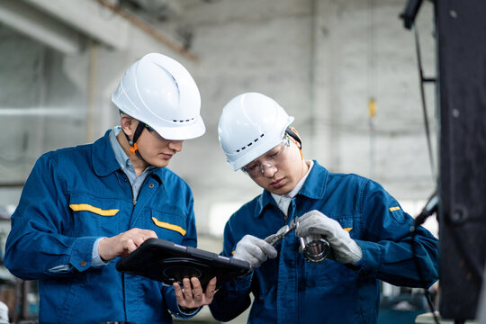 asian male engineer working in factroy