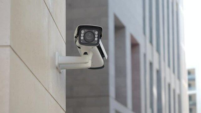 Surveillance camera mounted on building for security purposes