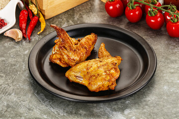 Tasty roasted chicken wing with spices