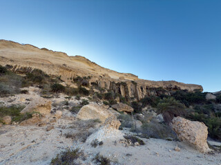 Canyon of Wadi Ash Shuwaymiyyah with unique stalactites in Oman