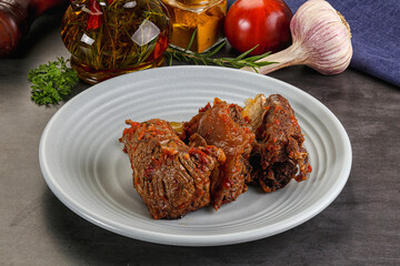 Baked beef ribs with vegetables