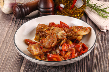 Baked lamb ribs with vegetables