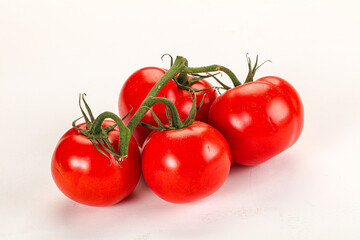 Ripe fresh tomato on the branch