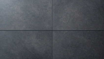 Fototapeta premium Uniform, dark gray granite surface with a subtle granular texture. Provides a solid and natural background.