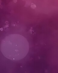 Fototapeta premium Abstract Purple Bokeh Background with Glowing Particles