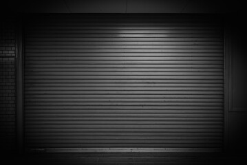 Closed steel door for dark steel metal store storage garage shuttle door background and texture.