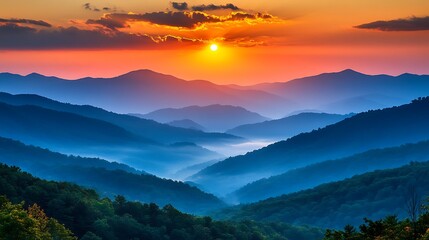 Obraz premium Colorful Sunrise Over Misty Mountain Ranges