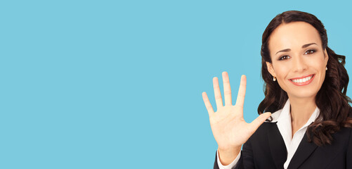 Ad concept image - happy smile brunette businesswoman business woman executive person wear black corporate suit, show five fingers hand sign gesture, isolated bright blue plain background