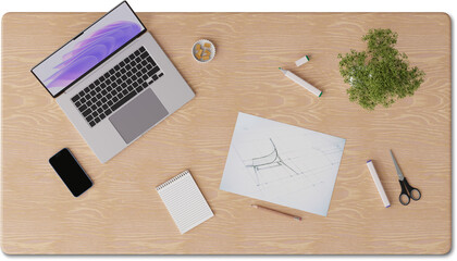 top view of desk with laptop, notepad and sketch