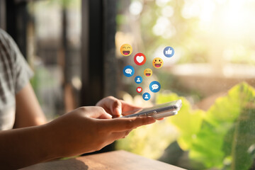 The concept of living on vacation and playing social media. Social media and digital online concept, man using smart phone with Social media. Social Distancing ,Working From Home concept..