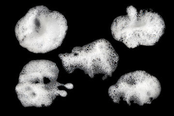Black background foam white texture thick bubbles top view body shower cream