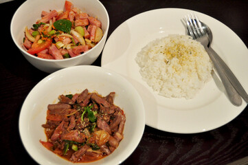Thai people preparing and cooking creative fusion food for dining