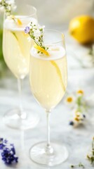 Refreshing lemon elderflower sparkling drinks with floral garnish in glasses National Alcohol Awareness Month
