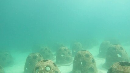 Underwater artificial reef structures captured while scuba diving near Phuket, Koh Phi Phi, Thailand, showcasing marine conservation and coral restoration efforts.