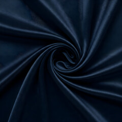 Top view of midnight blue satin fabric with minimal swirl isolated on white background