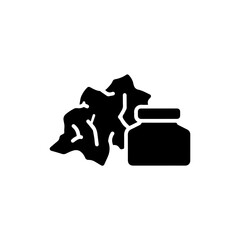 Icon of Crumpled Rag Beside Ink Pot in Black Silhouette Style