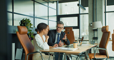 Businessman listening carefully to colleague