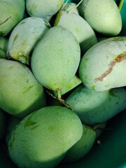 green mangoes in the market