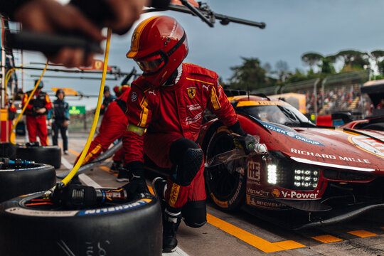 Ferrari AF Corse 499P LMDh at the pitlane during refuel and tyre change