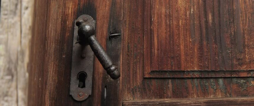 Vintage door handle pushing 4K anamorphic video