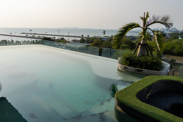 Infinity pool overlooking ocean a scenic and tranquil coastal leisure experience