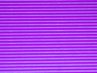 Top view, surface of bright purple corrugated cardboard background. Concept for design, image, text...