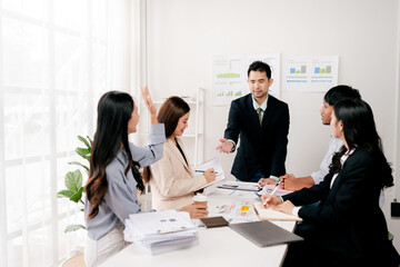 Modern youth are gathering, working as a team, and holding team meetings to achieve their goals.