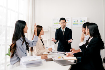 Modern youth are gathering, working as a team, and holding team meetings to achieve their goals.