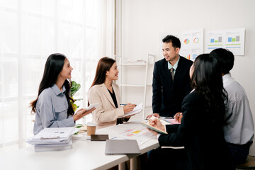 Modern youth are gathering, working as a team, and holding team meetings to achieve their goals.