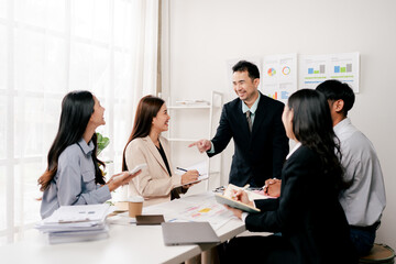 Modern youth are gathering, working as a team, and holding team meetings to achieve their goals.